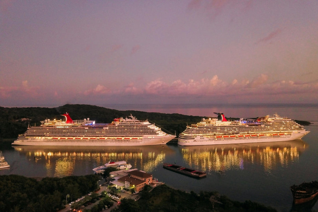 Two cruise ships docked at sunset, feature image for cruise deal booking strategies