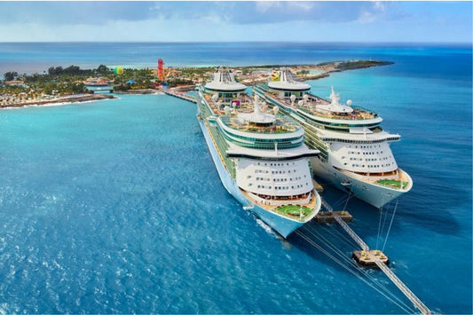 Cruise ships docked at a tropical island port, perfect destination for first-time cruise travellers – 7 step cruise planning checklist